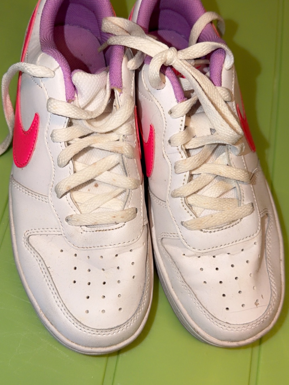 Nike Kids White Sneakers with Pink Swoosh and Purple Lining